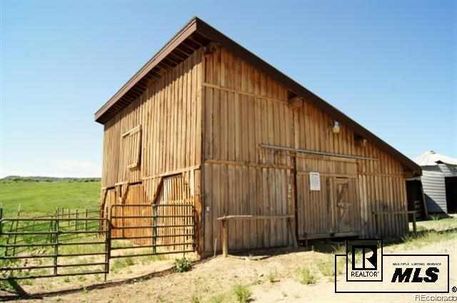 46450 Rcr 46 Steamboat Springs, Unit LONESOME EAGLE RANCH Steamboat Springs, CO 80487 - Photo 5 of 17 a view of a house with a wooden fence