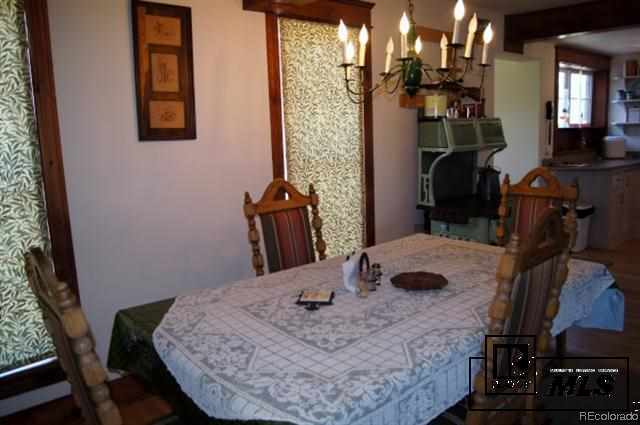 46450 Rcr 46 Steamboat Springs, Unit LONESOME EAGLE RANCH Steamboat Springs, CO 80487 - Photo 8 of 17 a view of a dining room with furniture