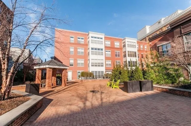 a view of a building with sitting area