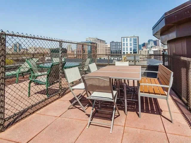 a dining area with furniture and outdoor view
