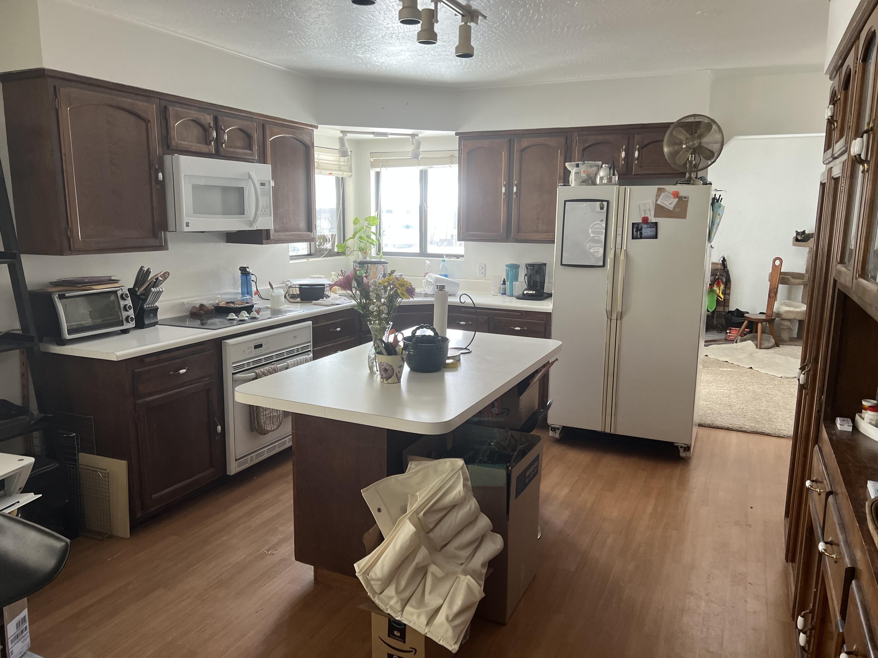 4945 Rim Wood Road Pine, AZ 85544 - Photo 6 of 26 a kitchen with stainless steel appliances a sink a counter space and a refrigerator