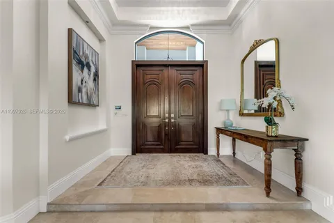 a view of livingroom with painting and a clock
