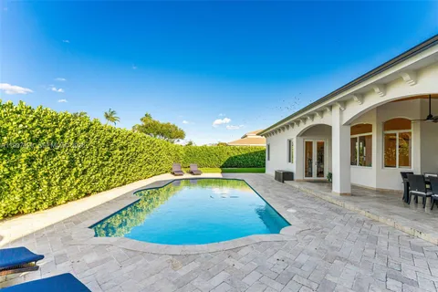 a view of swimming pool with outdoor seating