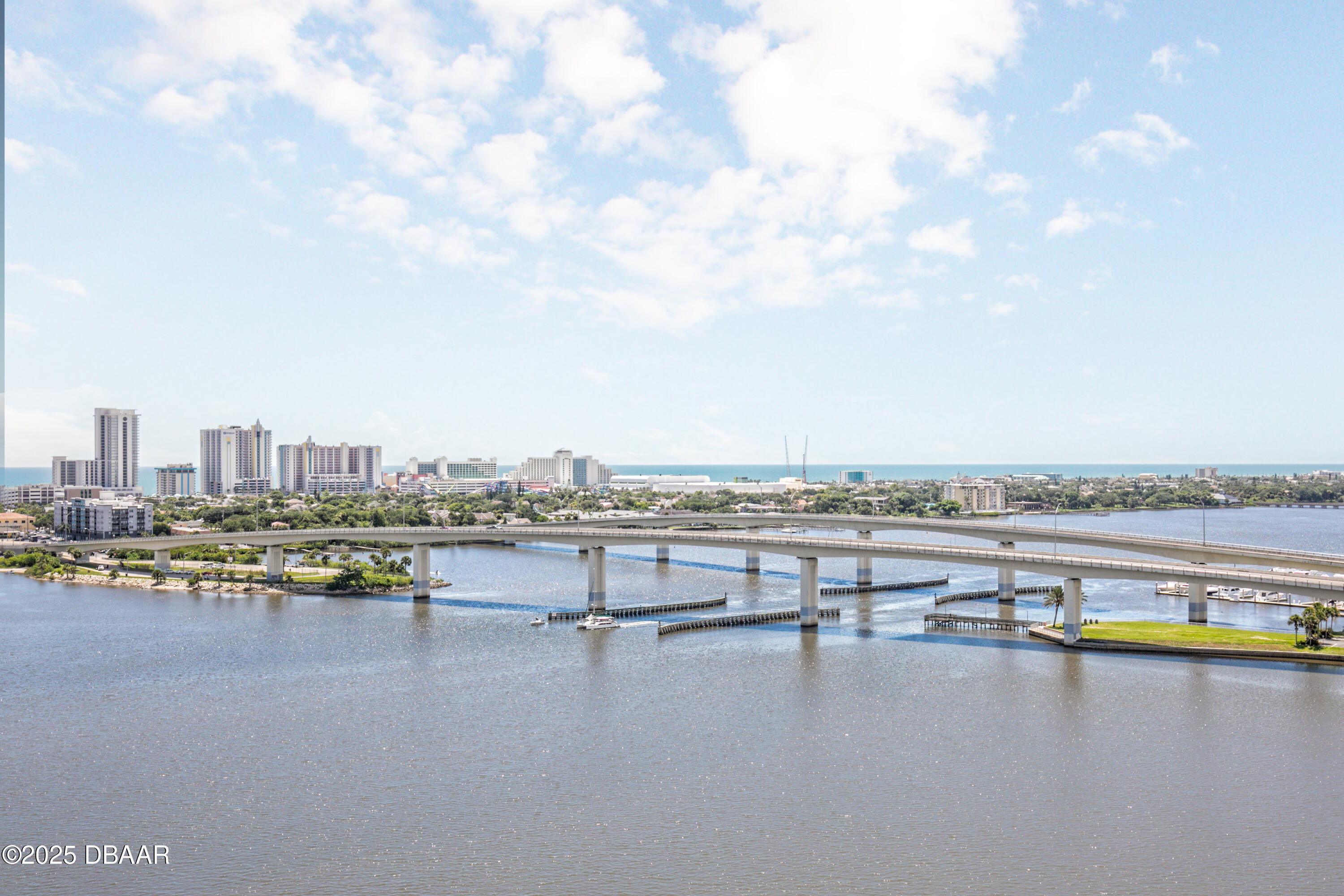 231 Riverside Drive, Unit 1602 Holly Hill, FL 32117 - Photo 31 of 45 a view of a city with lake