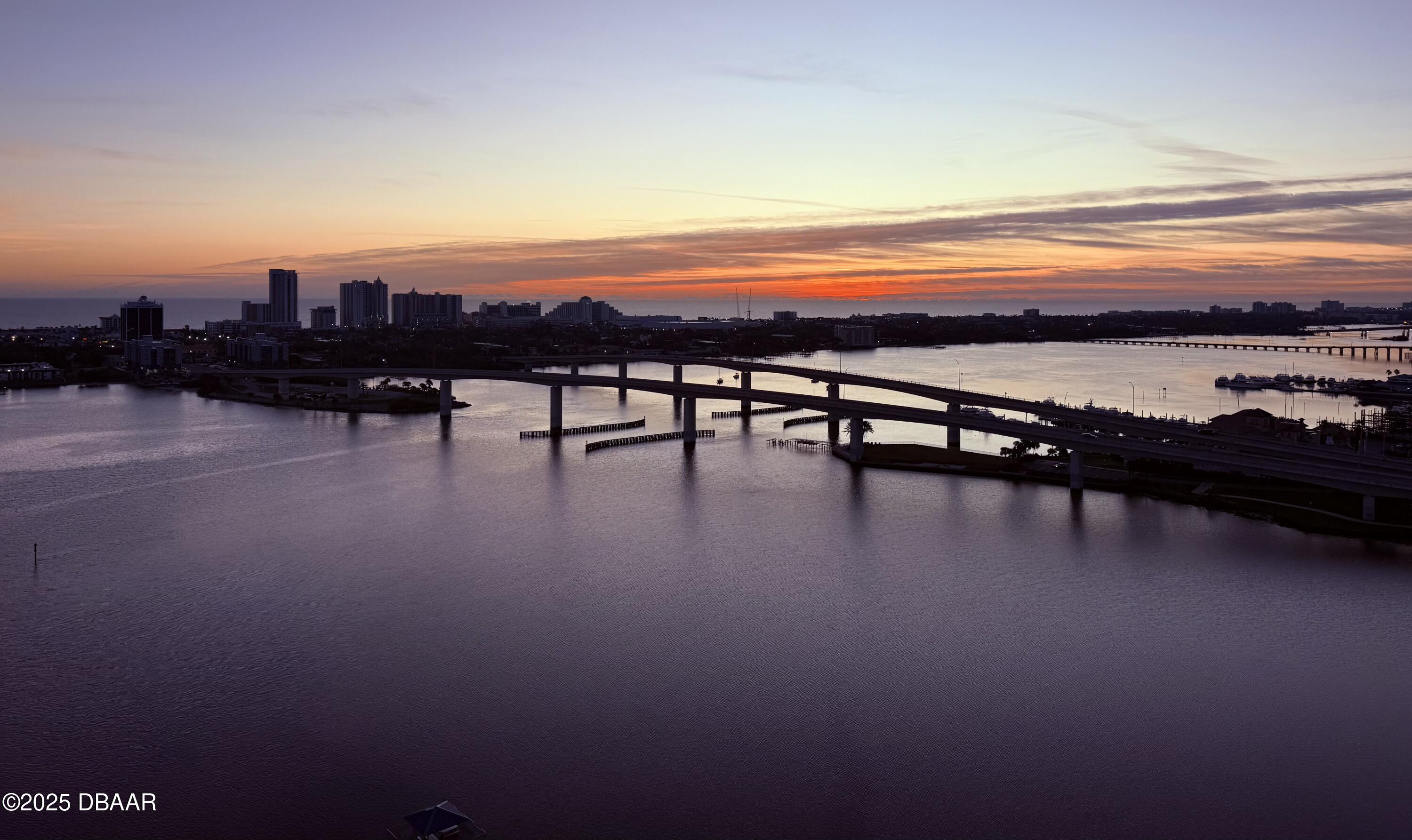 231 Riverside Drive, Unit 1602 Holly Hill, FL 32117 - Photo 35 of 45 a view of a terrace with lawn chairs and ocean view