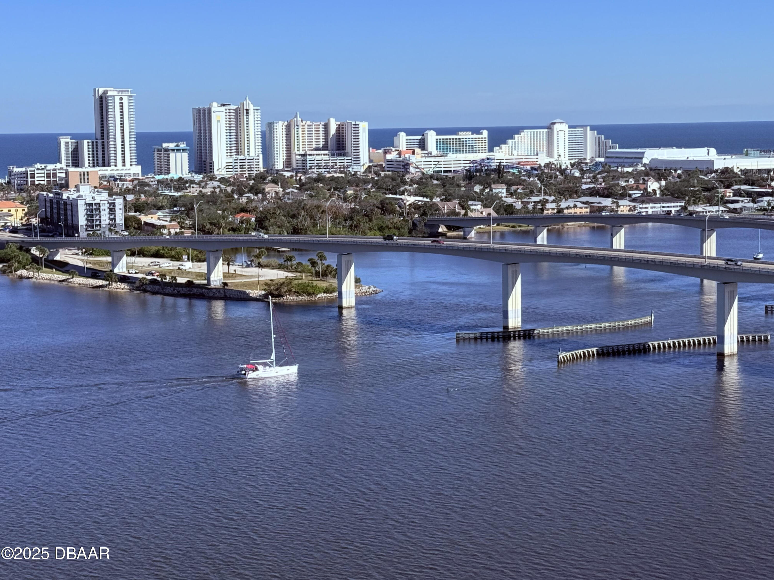 231 Riverside Drive, Unit 1602 Holly Hill, FL 32117 - Photo 37 of 45 a view of a living room with furniture and a floor to ceiling window