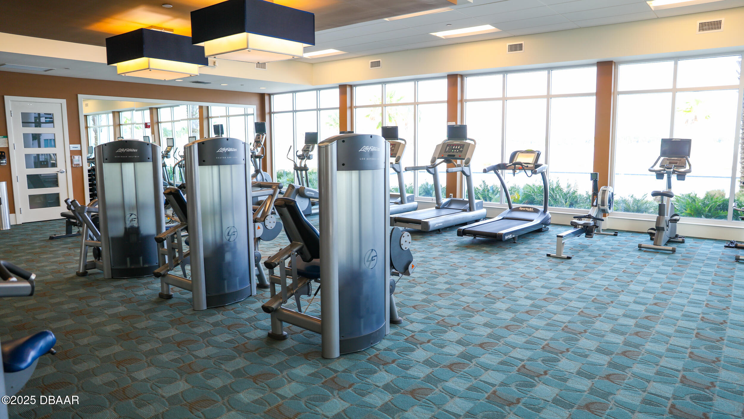 231 Riverside Drive, Unit 1602 Holly Hill, FL 32117 - Photo 41 of 45 a view of a room with gym equipment
