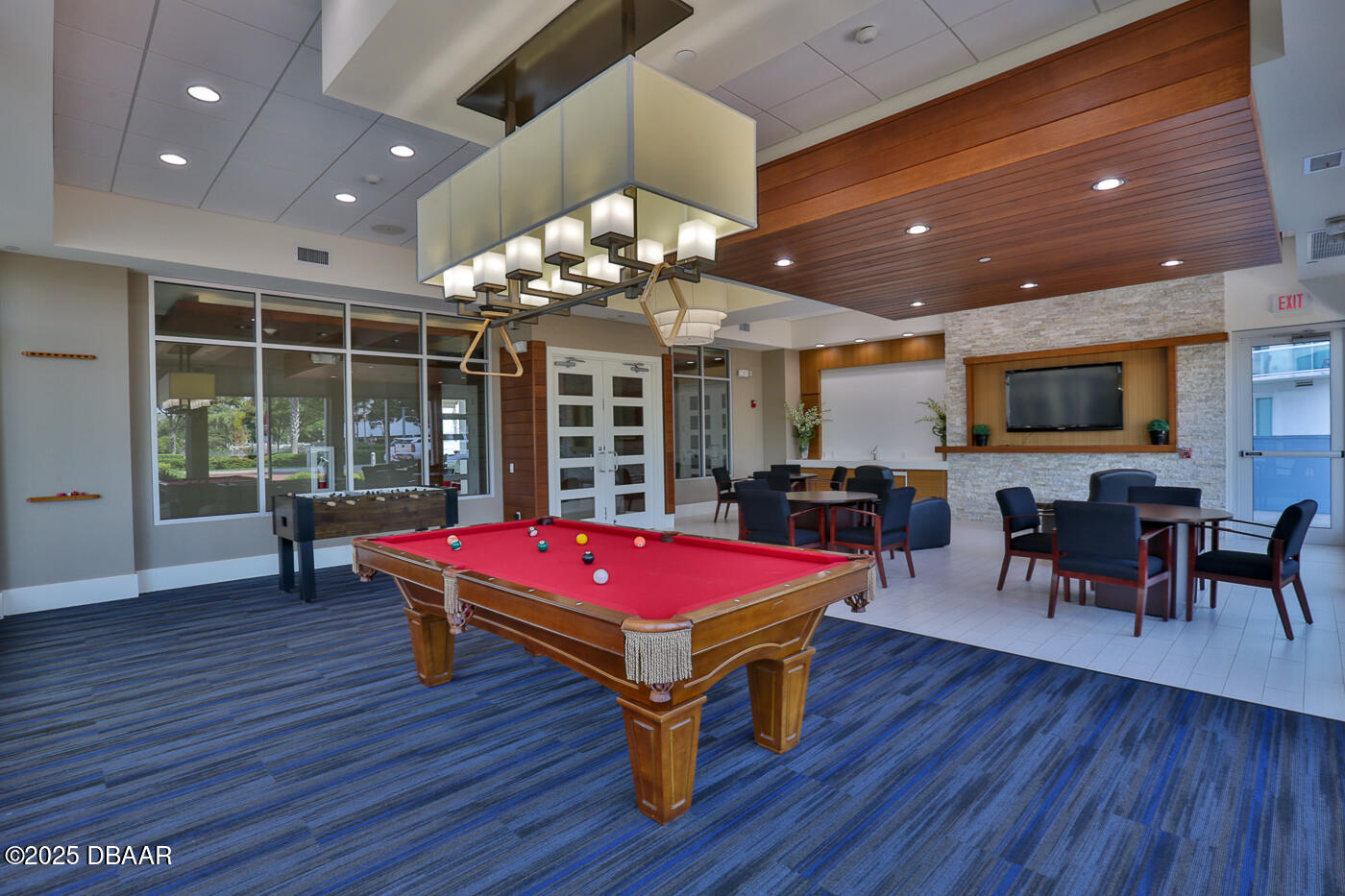 231 Riverside Drive, Unit 1602 Holly Hill, FL 32117 - Photo 43 of 45 a room with pool table windows and wooden floor
