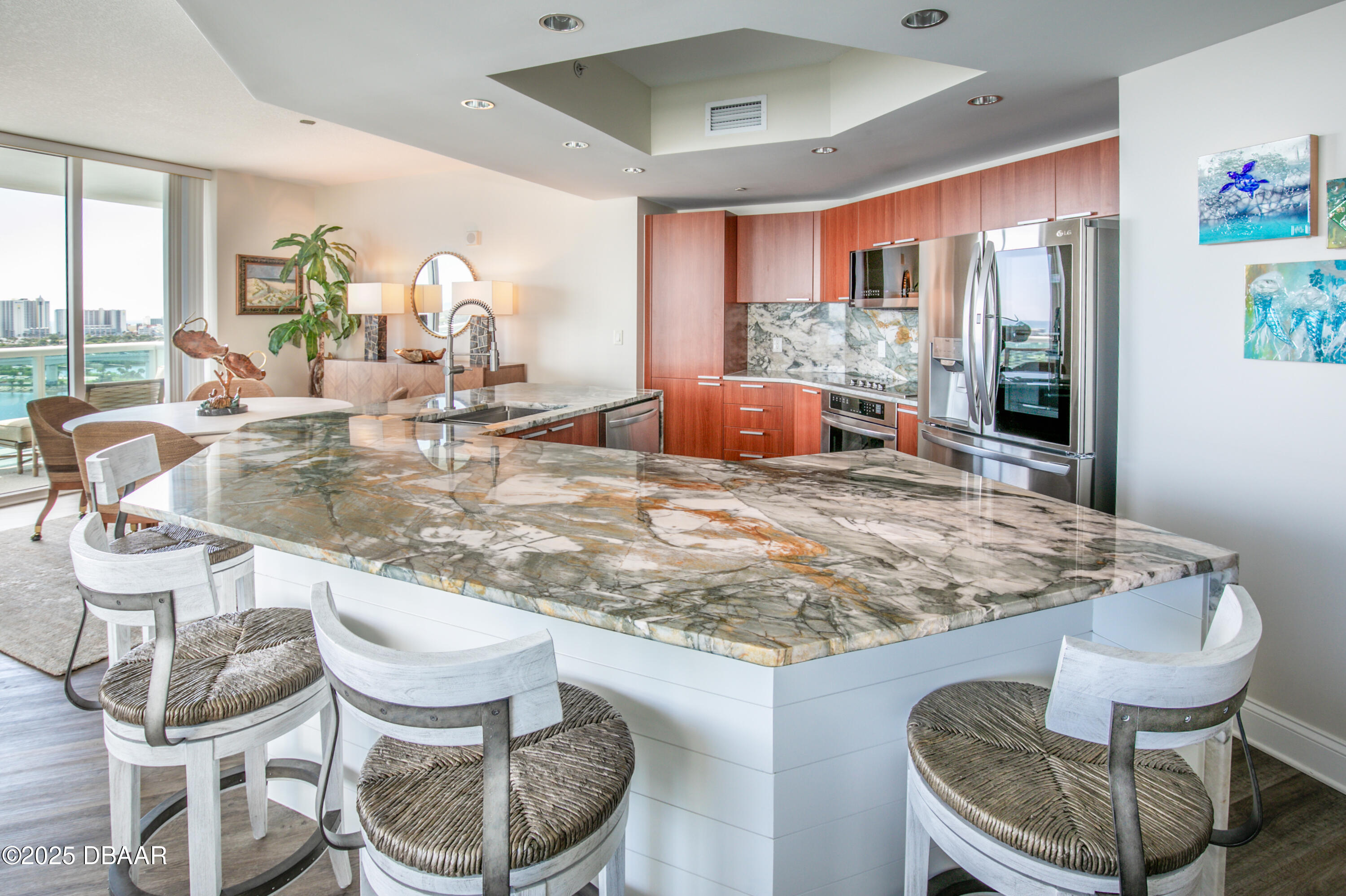 231 Riverside Drive, Unit 1602 Holly Hill, FL 32117 - Photo 6 of 45 a view of a dining room with furniture