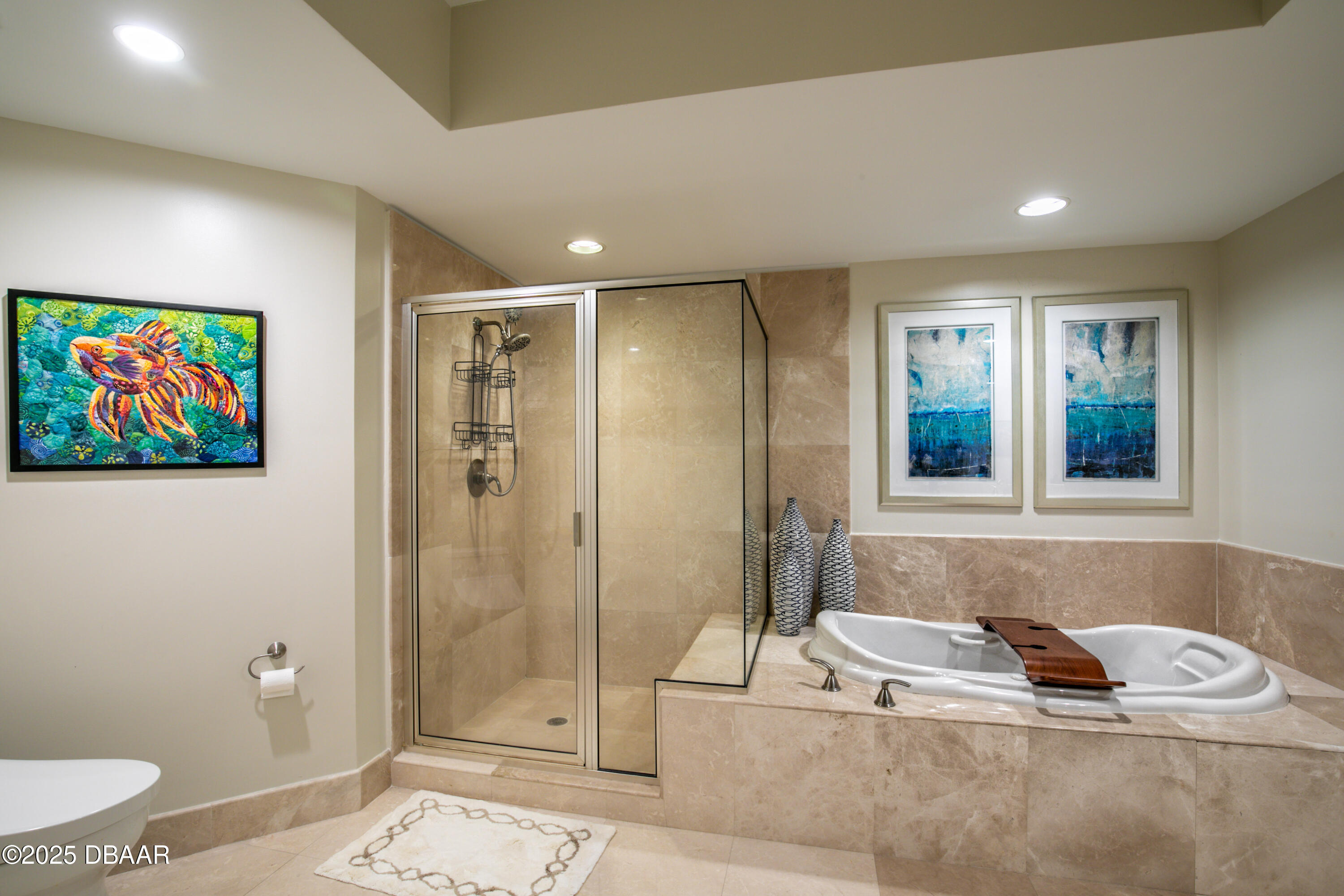 231 Riverside Drive, Unit 1602 Holly Hill, FL 32117 - Photo 10 of 45 a bathroom with a tub a toilet and a shower