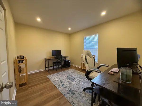 a view of a workspace with furniture