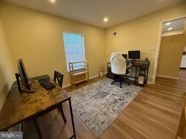 a view of a workspace with furniture