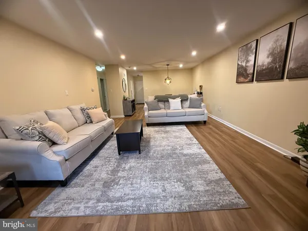 a living room with furniture and a rug