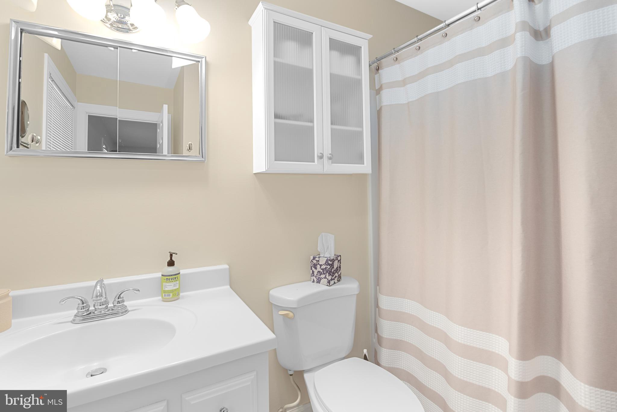 6379 Cedar Cove Road Royal Oak, MD 21662 - Photo 16 of 32 a bathroom with a sink toilet and shower