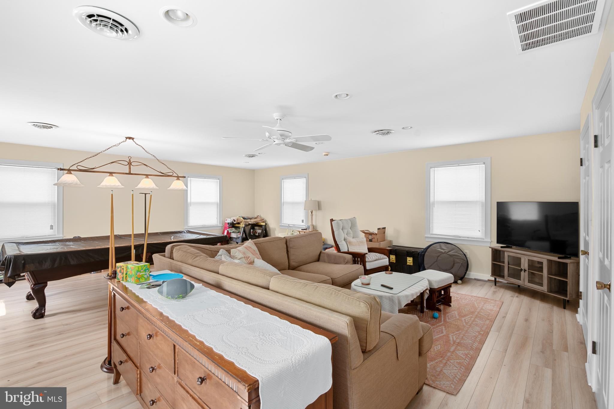 6379 Cedar Cove Road Royal Oak, MD 21662 - Photo 23 of 32 a living room with furniture and a flat screen tv