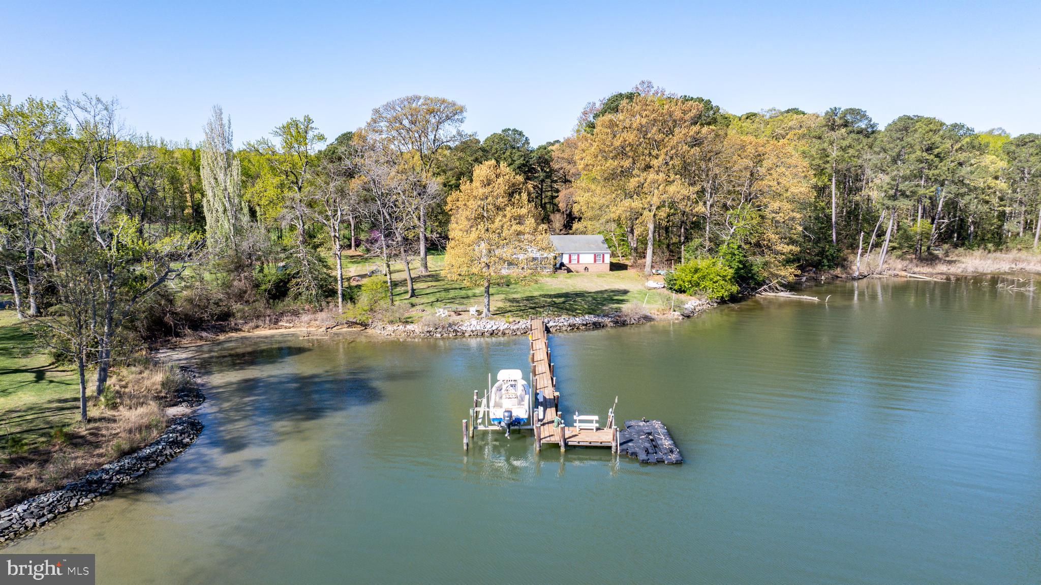 6379 Cedar Cove Road Royal Oak, MD 21662 - Photo 28 of 32 a view of a lake with a mountain in the background