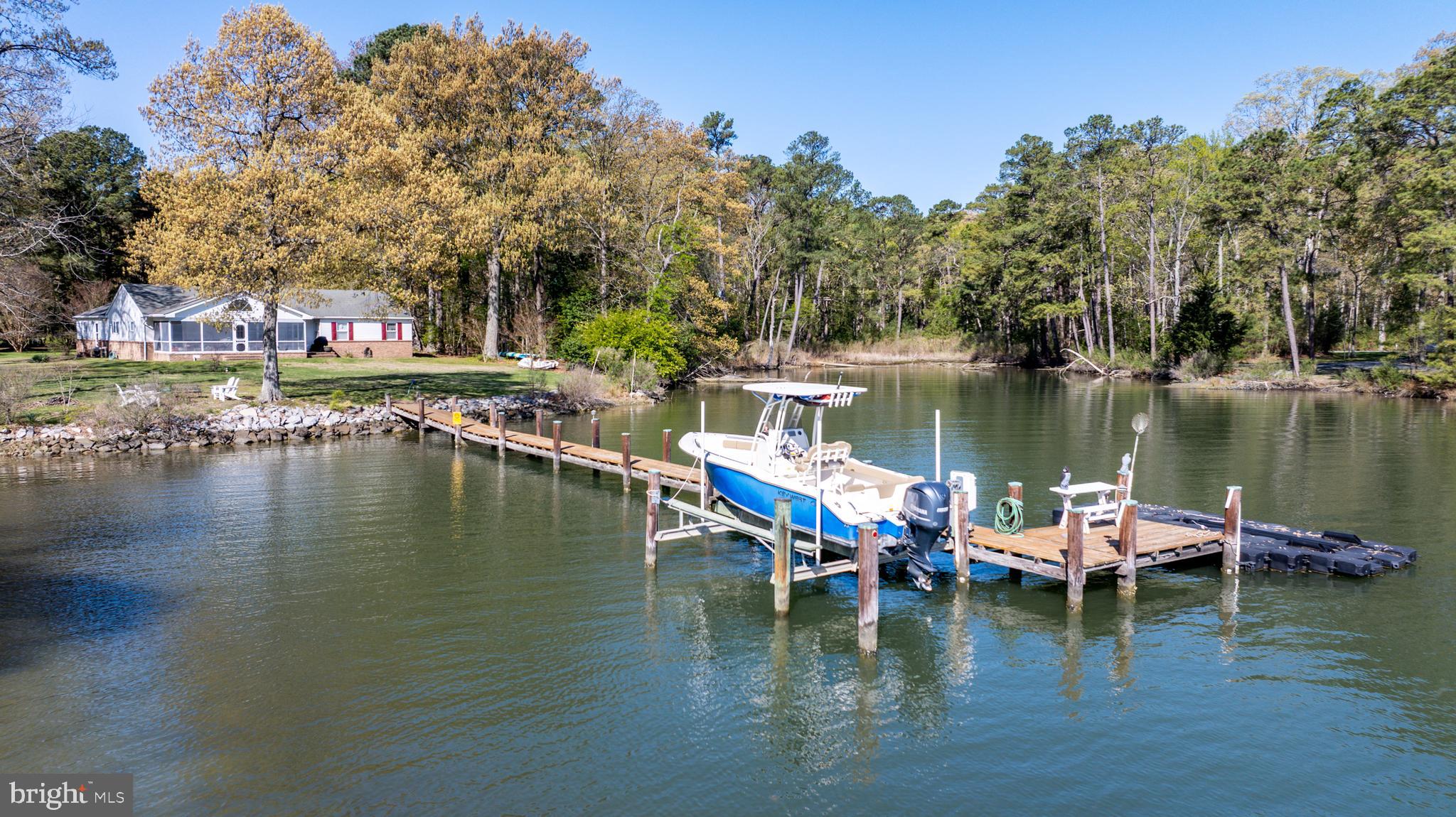 6379 Cedar Cove Road Royal Oak, MD 21662 - Photo 32 of 32 a view of a lake with boats and trees in the background