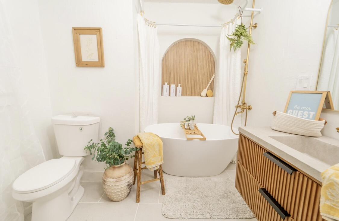 232 Ash Street Exeter, CA 93221 - Photo 10 of 13 a living room with a sink and a mirror