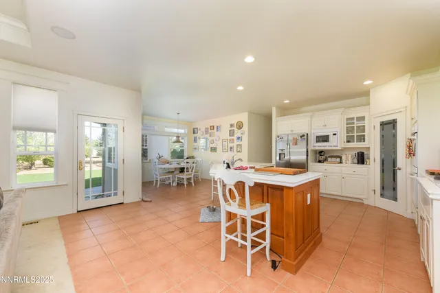 a view of a dining room with furniture and a livingroom