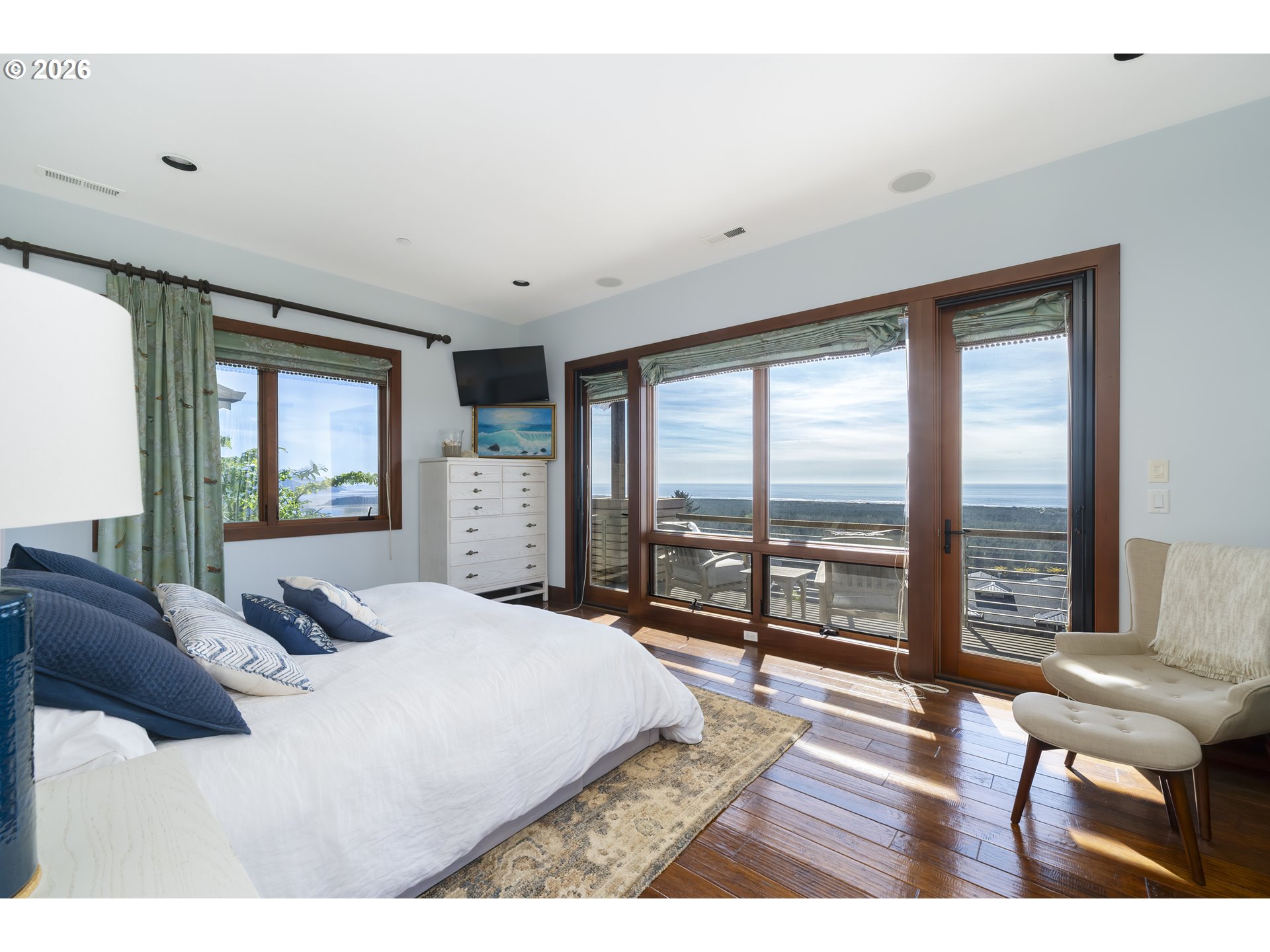 7850 Brooten Mountain Road Pacific City, OR 97135 - Photo 15 of 48 a bedroom with a large bed and large windows