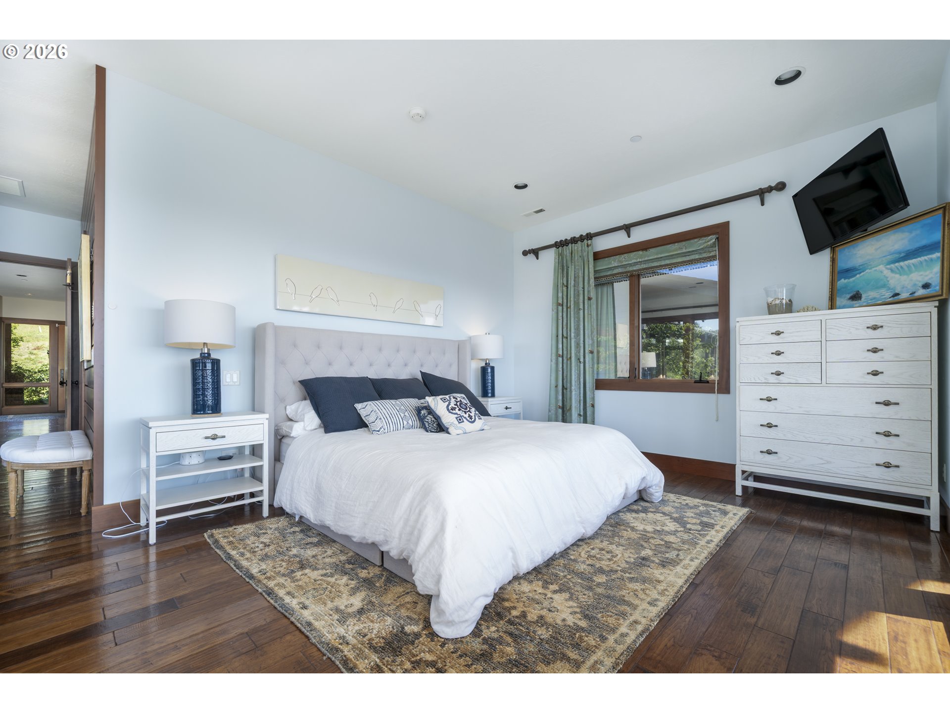 7850 Brooten Mountain Road Pacific City, OR 97135 - Photo 16 of 48 a bedroom with a bed and a flat tv screen on dresser