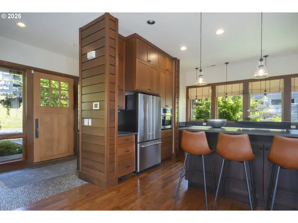a living room with furniture and large windows