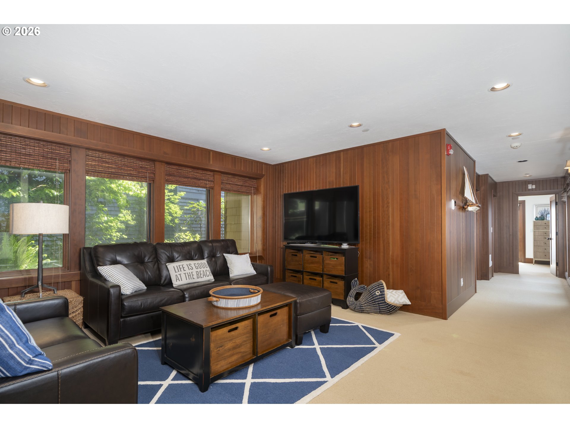 7850 Brooten Mountain Road Pacific City, OR 97135 - Photo 28 of 48 a living room with furniture a flat screen tv and a large window