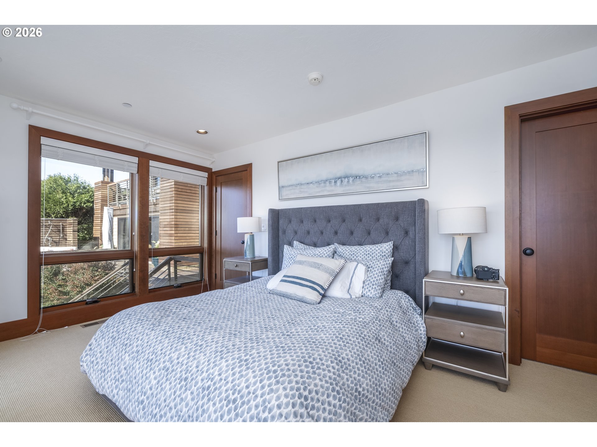 7850 Brooten Mountain Road Pacific City, OR 97135 - Photo 31 of 48 a bedroom with a large bed and a large window