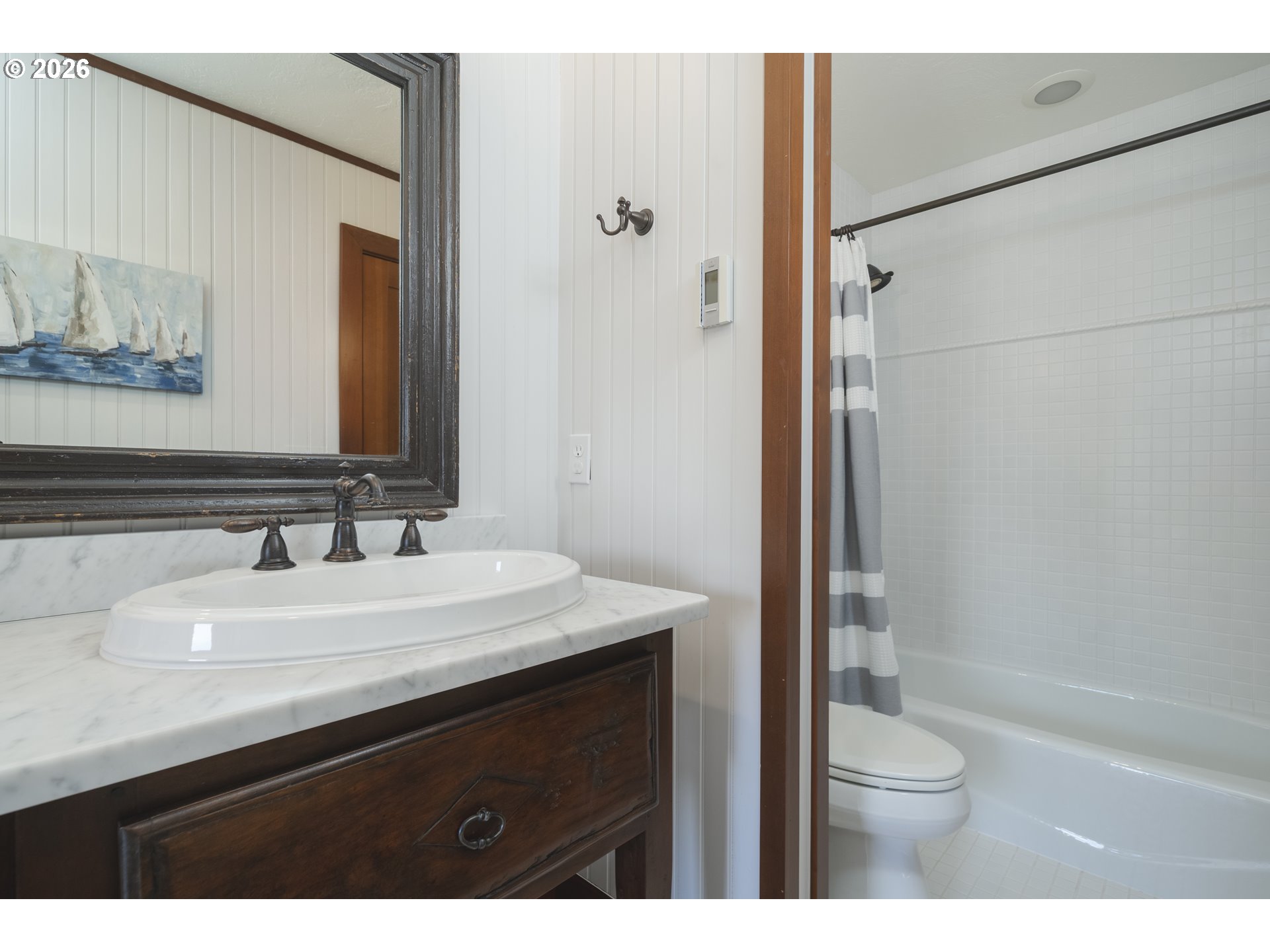 7850 Brooten Mountain Road Pacific City, OR 97135 - Photo 34 of 48 a bathroom with a sink a toilet a mirror and shower