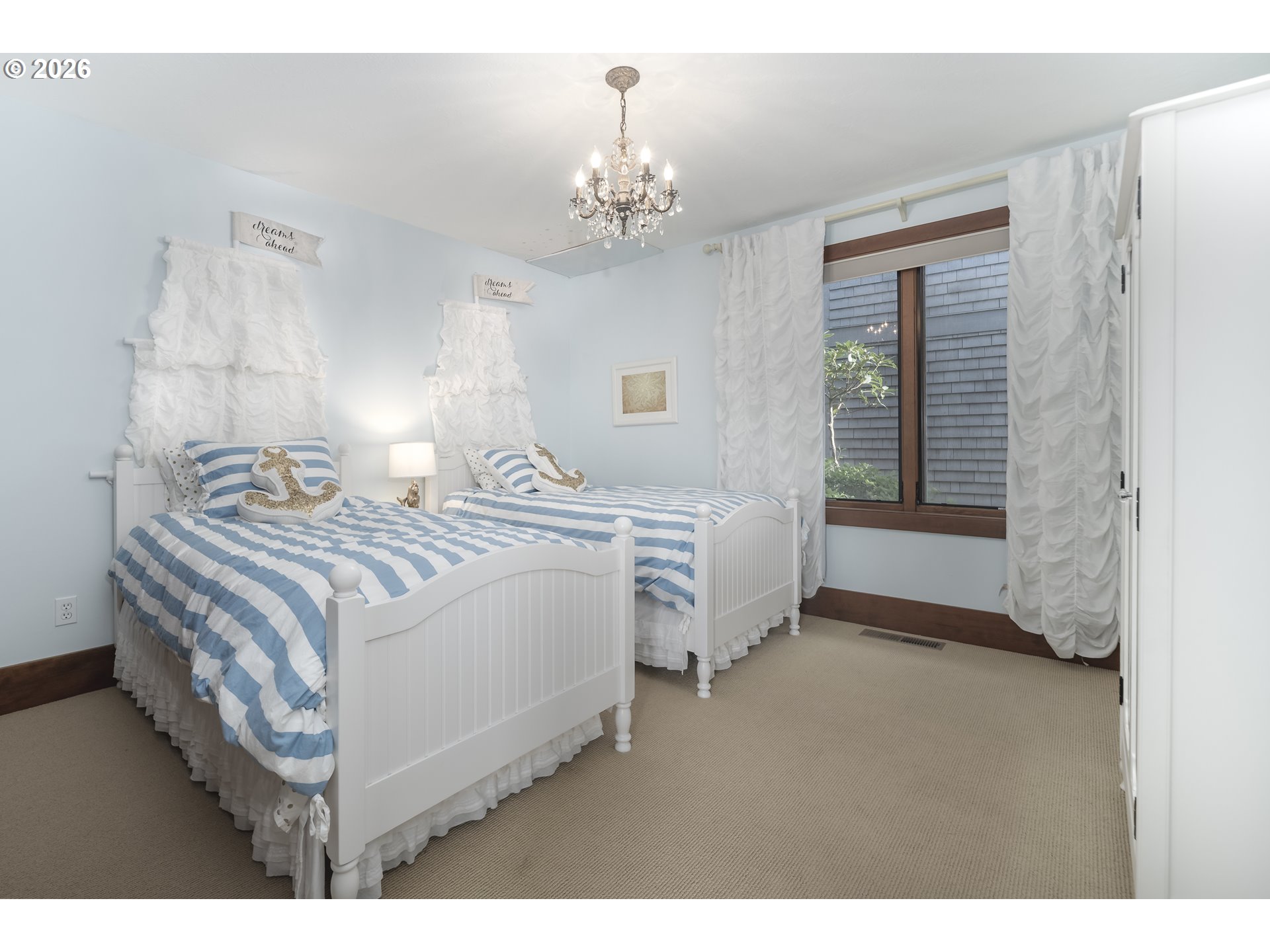 7850 Brooten Mountain Road Pacific City, OR 97135 - Photo 36 of 48 a bedroom with bed and a chandelier