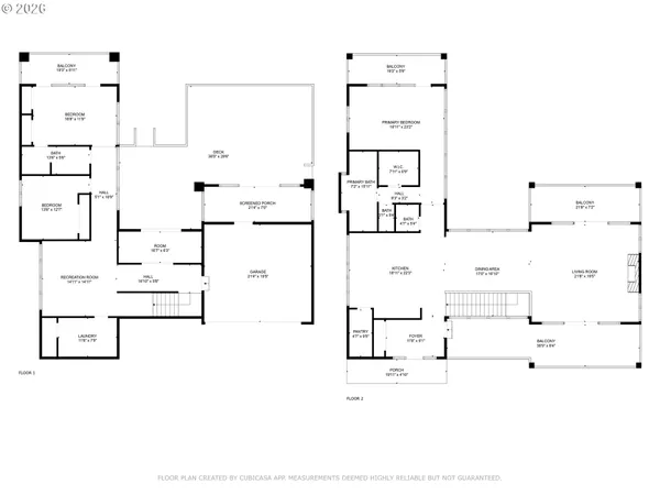 a living room with furniture a large window and wooden floor