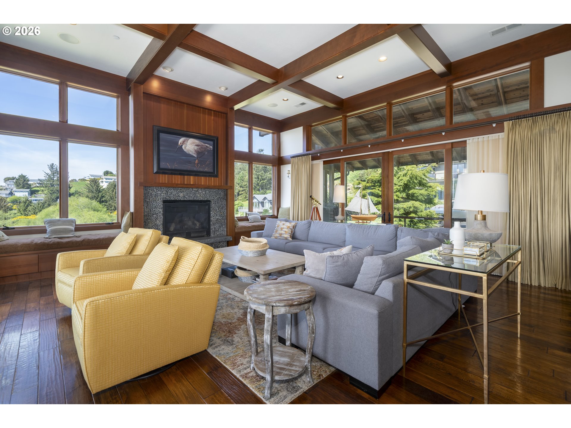 7850 Brooten Mountain Road Pacific City, OR 97135 - Photo 6 of 48 a living room with furniture a fireplace and a floor to ceiling window