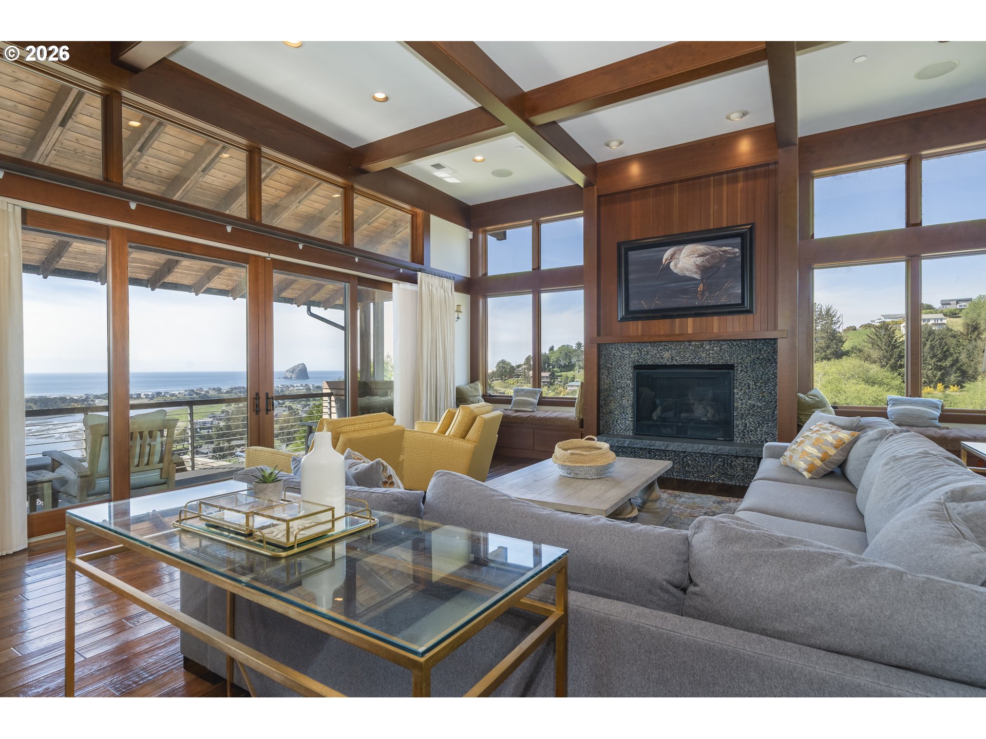 7850 Brooten Mountain Road Pacific City, OR 97135 - Photo 8 of 48 a living room with furniture a fireplace and a large window