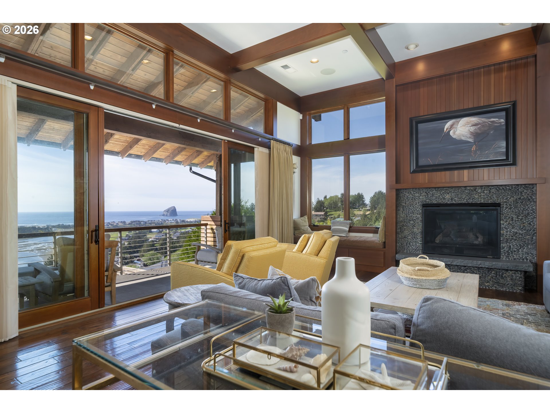 7850 Brooten Mountain Road Pacific City, OR 97135 - Photo 9 of 48 a living room with furniture a large window and a fireplace