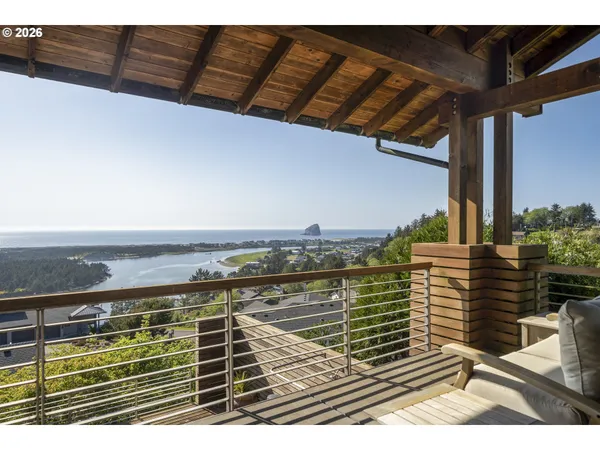a dining room with furniture window and outdoor view