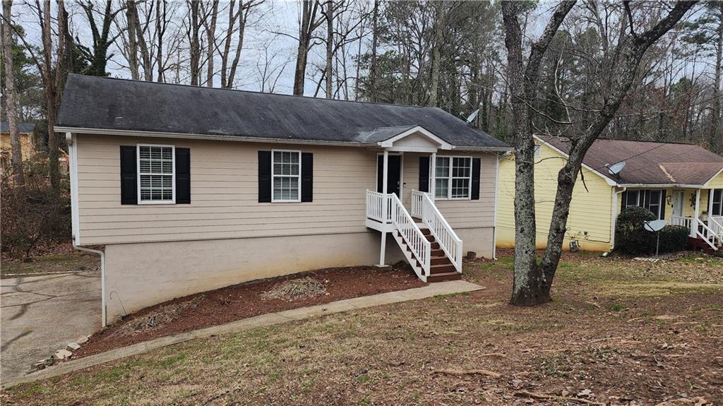2503 Ridgecrest Drive Northwest Kennesaw, GA 30152 - Photo 1 of 1 a front view of a house with a yard
