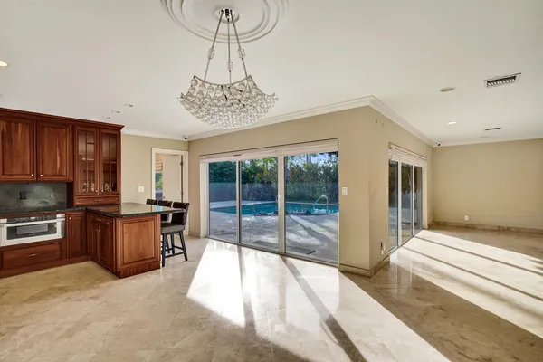 a very nice looking room with a large window and furniture
