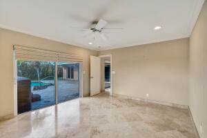 7050 Northeast 7th Avenue Boca Raton, FL 33487 - Photo 17 of 25 a view of an empty room with a balcony