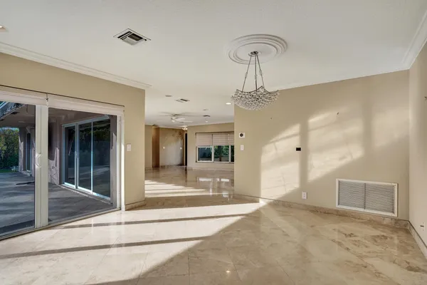 a view of a hallway with a chandelier