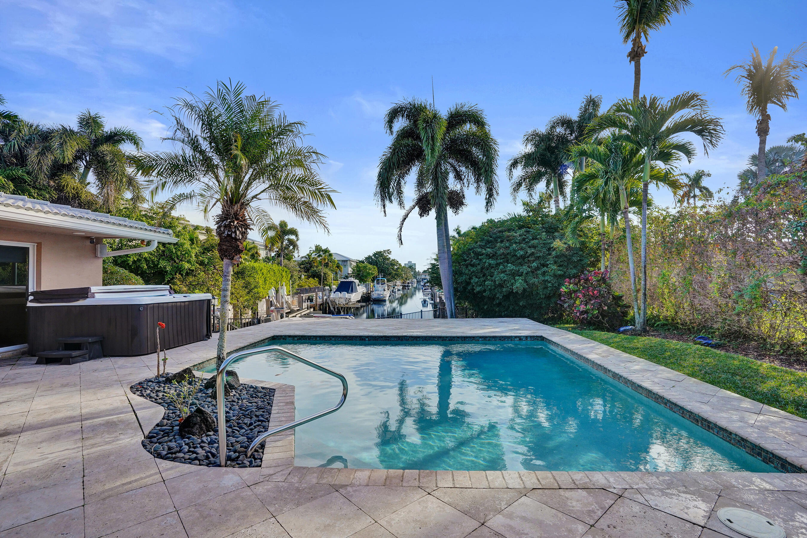 7050 Northeast 7th Avenue Boca Raton, FL 33487 - Photo 21 of 25 a view of a backyard with swimming pool
