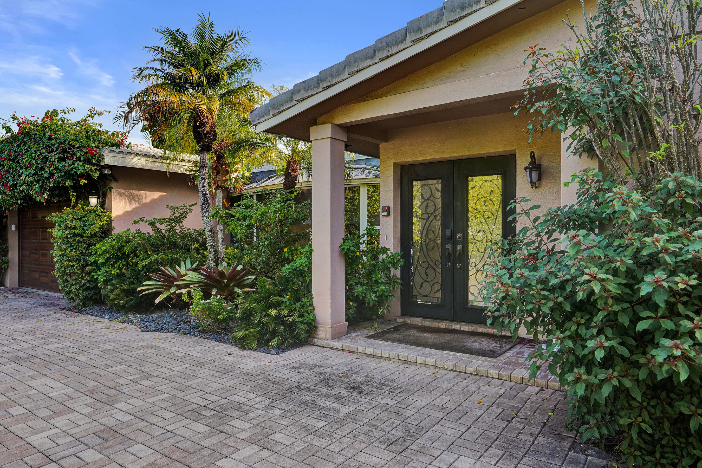 7050 Northeast 7th Avenue Boca Raton, FL 33487 - Photo 6 of 25 a view of a entrance gate of the house