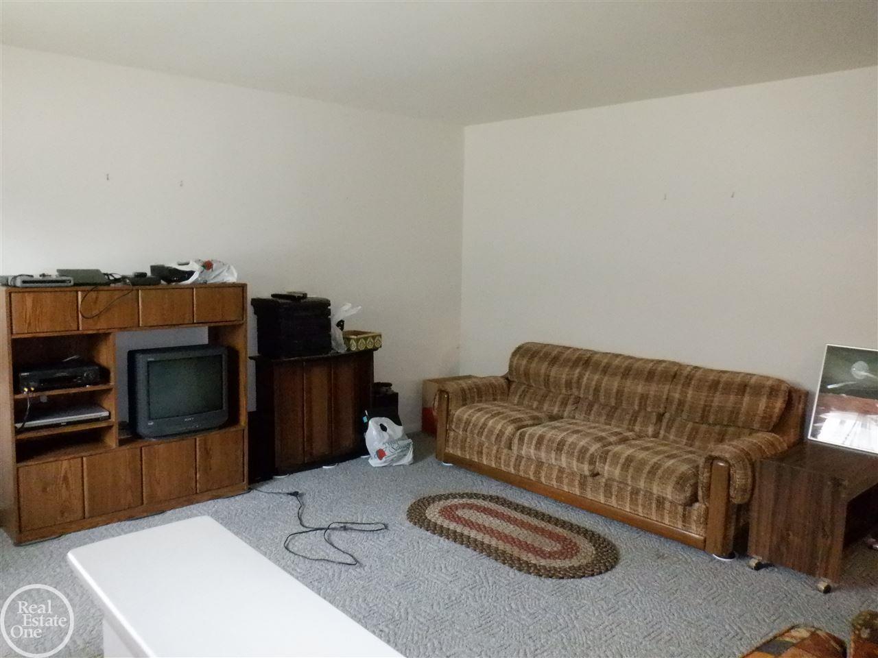 18355 13 Mile Road Fraser, MI 48026 - Photo 8 of 25 HW floors under carpet in