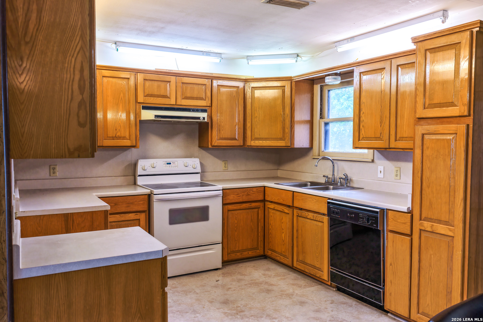 430 Watts Road Kingsbury, TX 78638 - Photo 30 of 37 a kitchen with stainless steel appliances a stove sink and cabinets