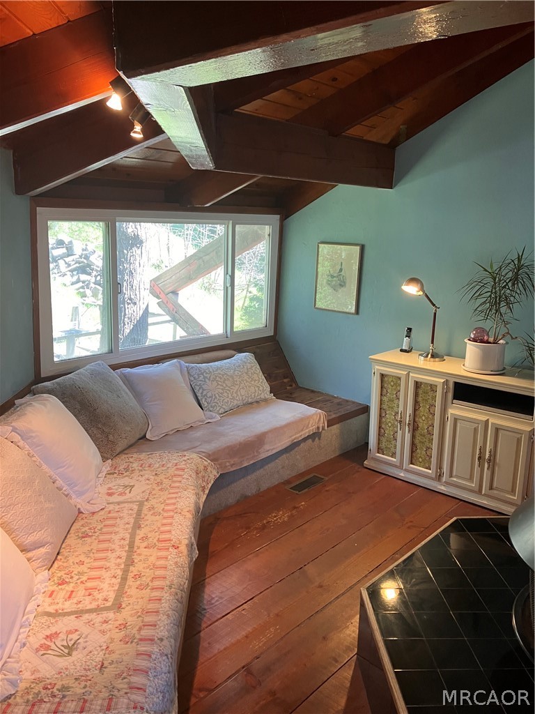 23228 Brookside Road Crestline, CA 92325 - Photo 14 of 23 a bedroom with a bed next to a window