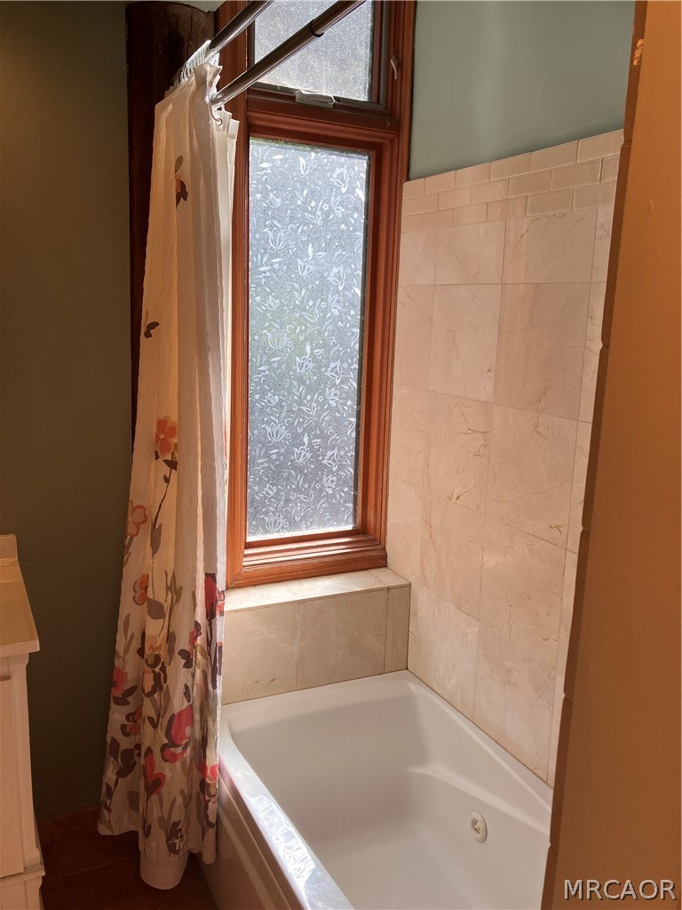 23228 Brookside Road Crestline, CA 92325 - Photo 18 of 23 a bathroom with a bathtub and shower