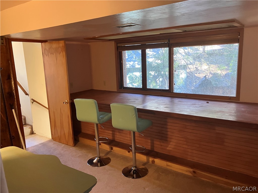 23228 Brookside Road Crestline, CA 92325 - Photo 23 of 23 a room with furniture and a window