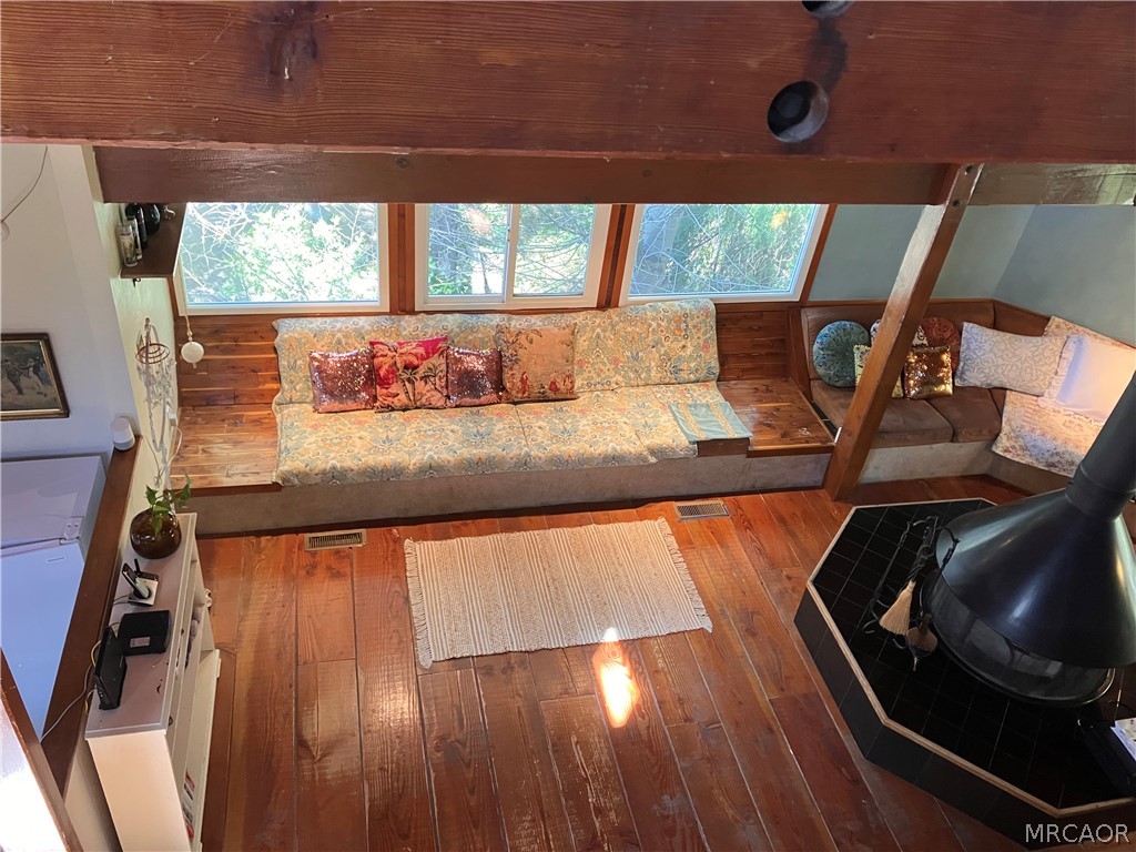 23228 Brookside Road Crestline, CA 92325 - Photo 4 of 23 a view of a living room with furniture and a floor to ceiling window