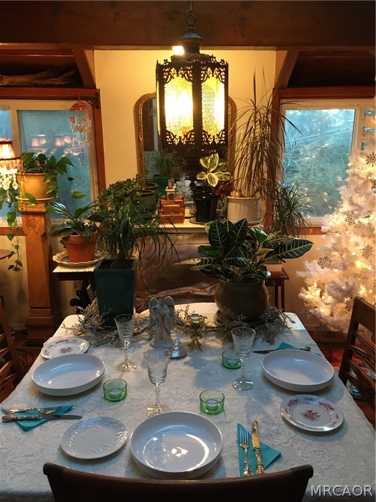 23228 Brookside Road Crestline, CA 92325 - Photo 6 of 23 a table with chairs and a potted plant