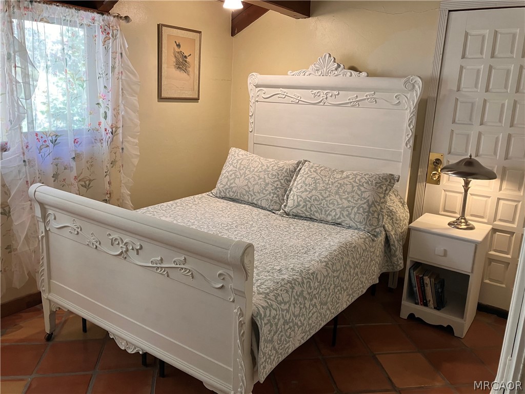 23228 Brookside Road Crestline, CA 92325 - Photo 7 of 23 a bedroom with a bed and a window