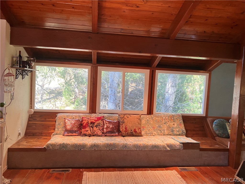 23228 Brookside Road Crestline, CA 92325 - Photo 8 of 23 a living room with a large bed and a large window